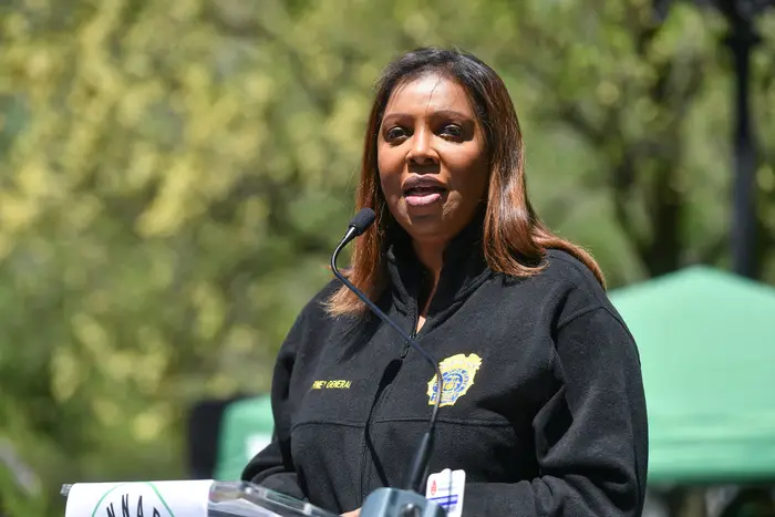Letitia James, in a New York Attorney General jacket, addresses a crowd